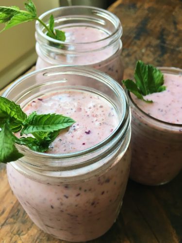 Mason jars filled with Mint Berry Smoothie